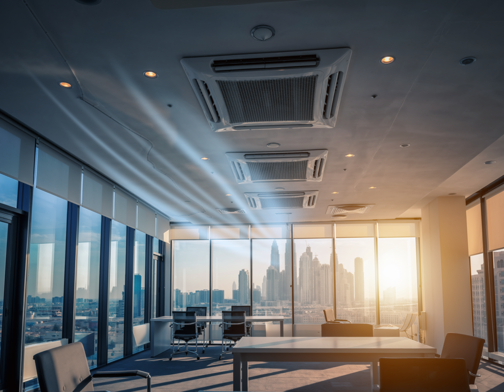 Dust-covered outdoor AC condenser units on a Dubai rooftop in hazy desert heat – ECO FRESH AIR Dubai